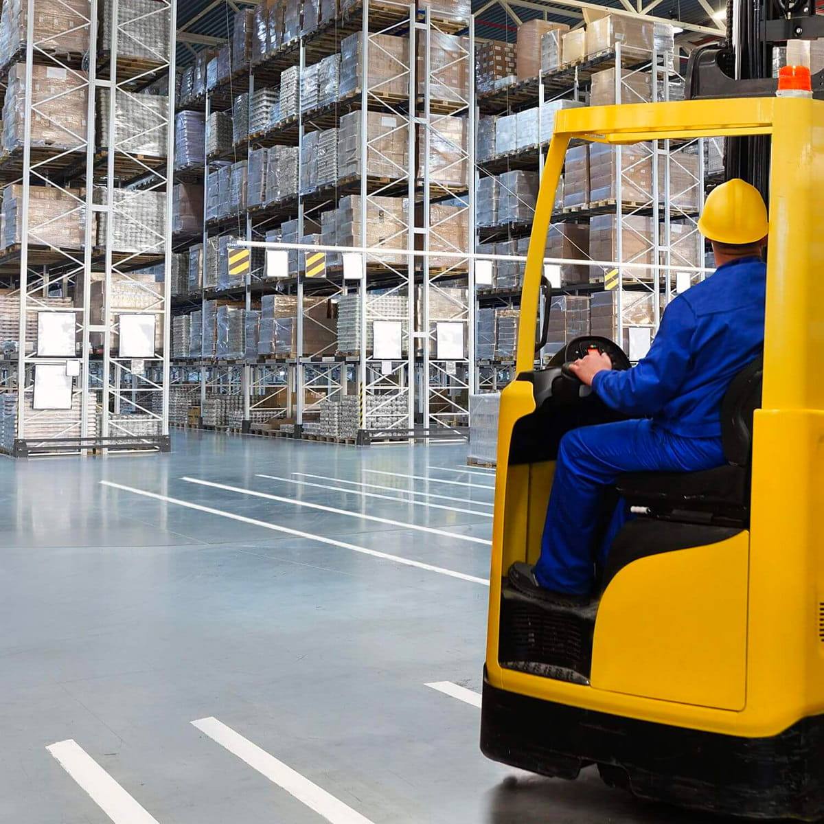 Warehouse worker driving a forklift truck