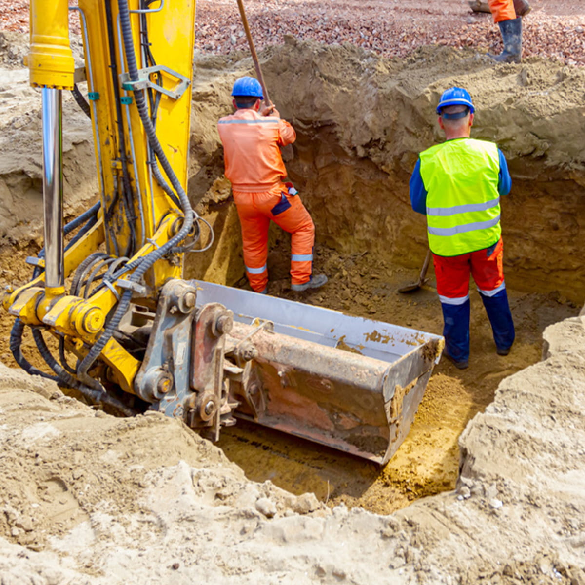 Construction workers reviewing work on a construction site.