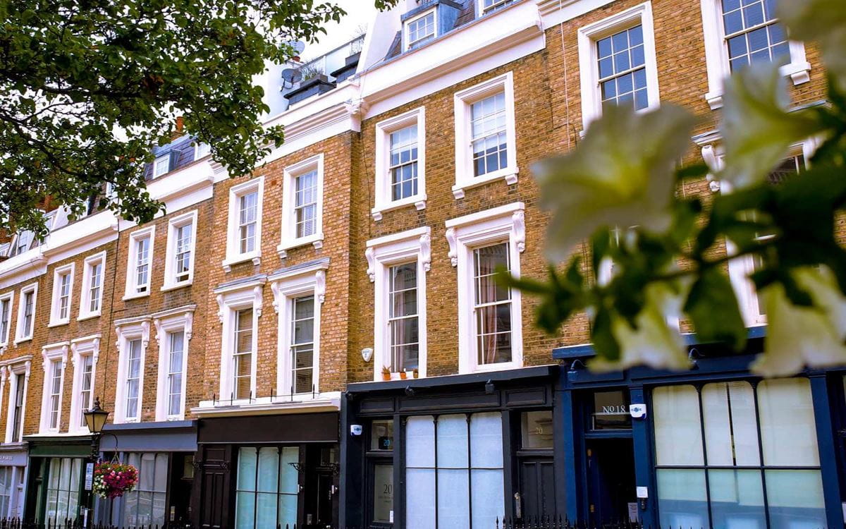 Terrace with shops on the ground floor and flats above